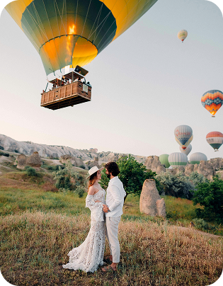 Woman looking at hot air balloons